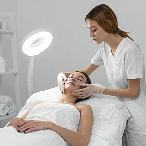 beautician-with-female-client-salon-face-care-routine (Custom) (1) beautician-with-female-client-salon-face-care-routine (Custom) (1)